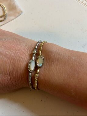 Kendra Scott lot of 2 Addison stretch bracelets 1 is silver and 1 is gold.